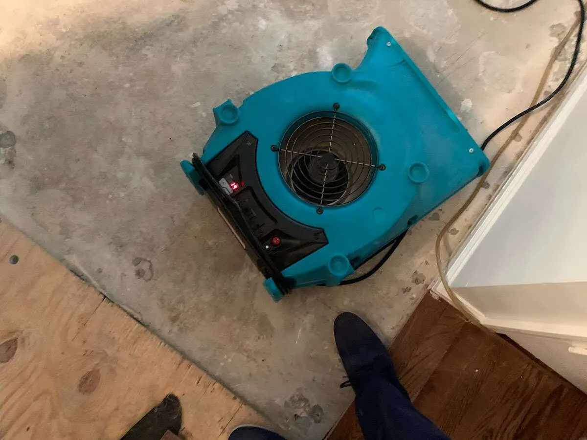 Air mover drying subfloor during Leak Detection & Repair in Siler City